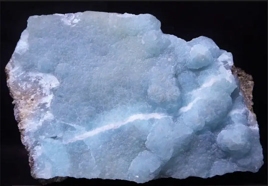 Pierre de smithsonite bleue du Mexique, cristal clair avec stries blanches rugueuses