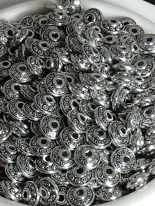 Breloque perle forme soucoupe Divers coloris 6mm X 4mm Prix perle à l’unité Diamètre 6mm / Argent Perles breloque forme soucoupe Divers