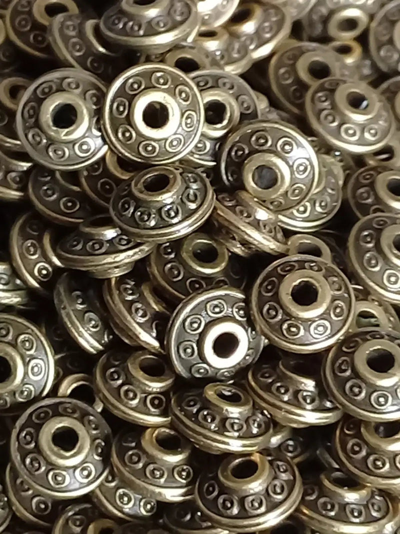 Load image into Gallery viewer, Breloque perle forme soucoupe Divers coloris 6mm X 4mm Prix perle à l’unité Diamètre 6mm / Bronze Perles breloque forme soucoupe Divers
