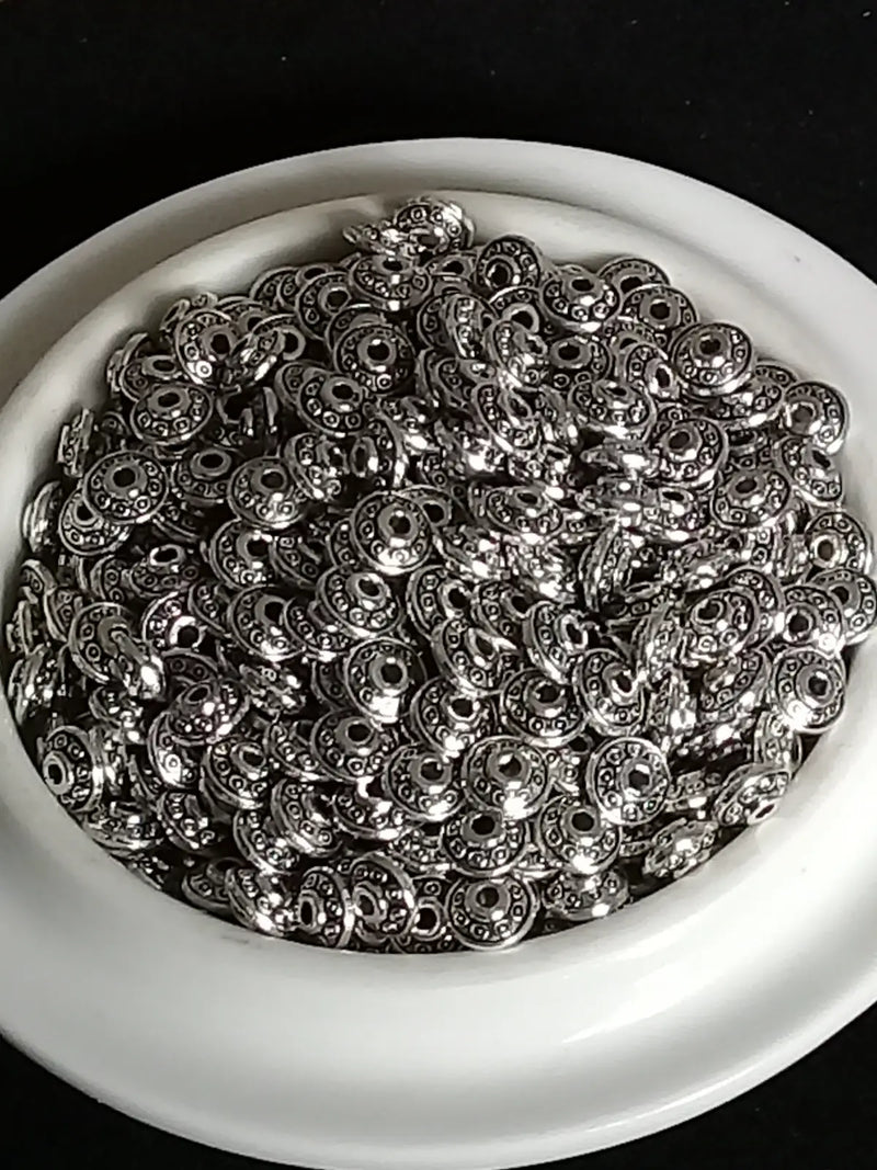 Load image into Gallery viewer, Breloque perle forme soucoupe Divers coloris 6mm X 4mm Prix perle à l’unité Perles breloque forme soucoupe Divers coloris
