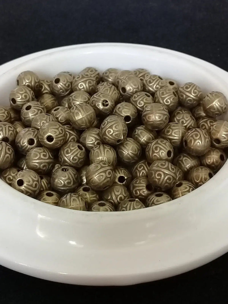 Chargez l'image dans la visionneuse de la galerie, Breloque perle métal couleur Bronze ancien Diamètre 7mm Prix perle à l’unité Diamètre 7mm Perles breloque métal couleur Bronze ancien
