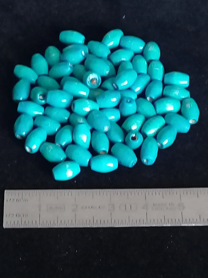 Load image into Gallery viewer, Perle bois bleue Turquoise Diam : 4mm X 8mm Prix perle à l’unité Perle bois bleue Diam : 4mm X 8mm Dans la besace du p&#39;tit Poucet   
