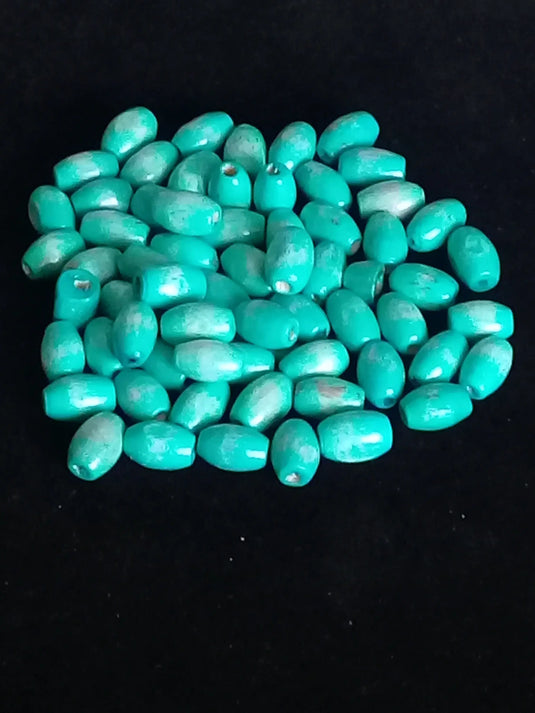 Perle bois bleue vert Diam : 4mm X 8mm Prix perle à l’unité Perle bois bleue vert Diam : 4mm X 8mm Dans la besace du p'tit Poucet   