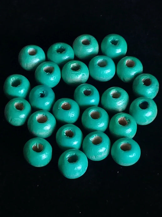 Perle bois bleue vert Diam : 8mm X 6mm Prix perle à l’unité Perle bois bleue vert Diamètre 8mm X 4mm Dans la besace du p'tit Poucet   