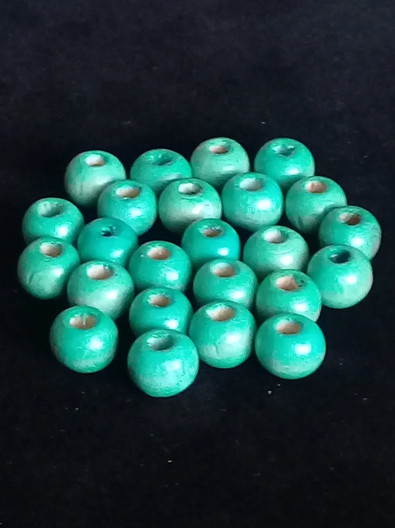 Cargue la imagen en el visor de la galería, Perle bois bleue vert Diam : 8mm X 6mm Prix perle à l’unité Perle bois bleue vert Diamètre 8mm X 4mm Dans la besace du p&#39;tit Poucet   

