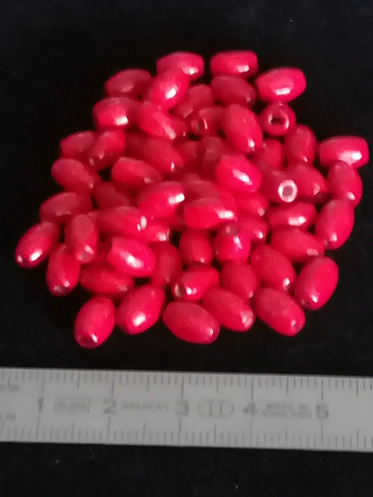 Perle bois rouge Corail Diam: 5mm X 8mm Prix perle à l’unité Perle en bois peinte en rouge Diamètre 5mm X 8mm
