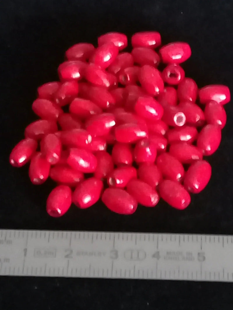 Cargue la imagen en el visor de la galería, Perle bois rouge Corail Diam : 5mm X 8mm Prix perle à l’unité Perle en bois peinte en rouge Diamètre 5mm X 8mm Dans la besace du p&#39;tit Poucet   
