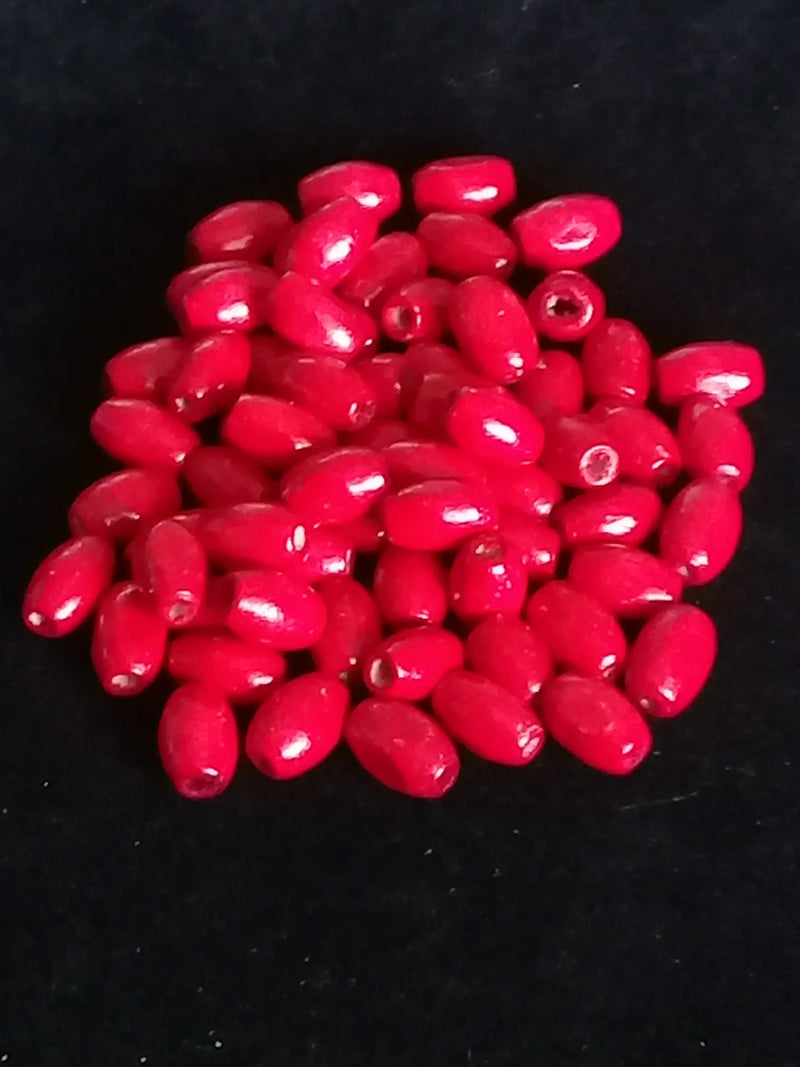 Load image into Gallery viewer, Perle bois rouge Corail Diam : 5mm X 8mm Prix perle à l’unité Perle en bois peinte en rouge Diamètre 5mm X 8mm Dans la besace du p&#39;tit Poucet   
