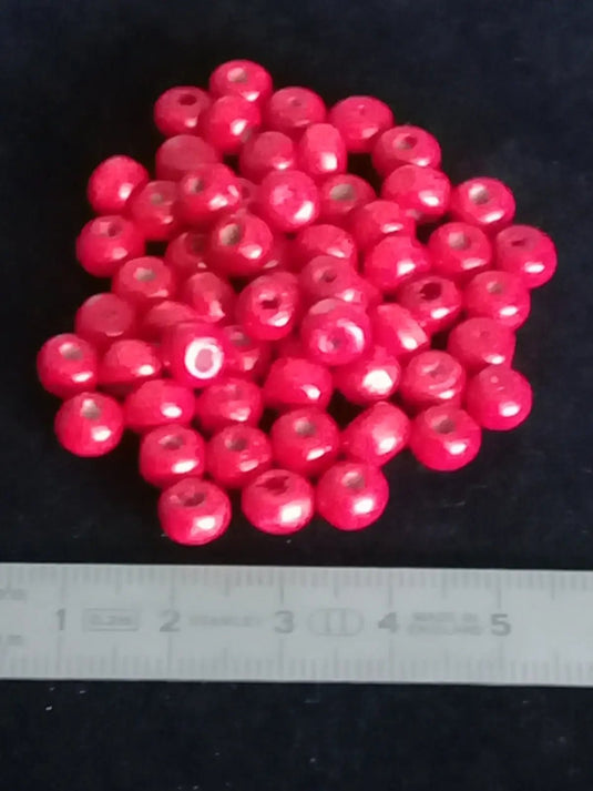 Perle bois rouge Corail Diam: 6 à 8mm X 5mm Prix perle à l’unité Perle en bois peinte en rouge Diamètre 6 à 8mm X 5mm