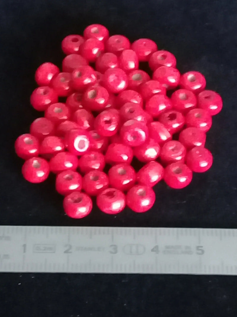 Cargue la imagen en el visor de la galería, Perle bois rouge Corail Diam : 6 à 8mm X 5mm Prix perle à l’unité Perle en bois peinte en rouge Diamètre 6 à 8mm X 5mm Dans la besace du p&#39;tit Poucet   
