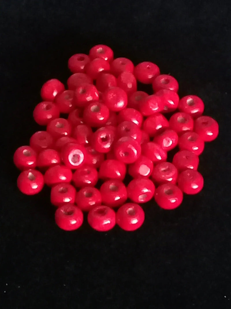 Load image into Gallery viewer, Perle bois rouge Corail Diam : 6 à 8mm X 5mm Prix perle à l’unité Perle en bois peinte en rouge Diamètre 6 à 8mm X 5mm Dans la besace du p&#39;tit Poucet   
