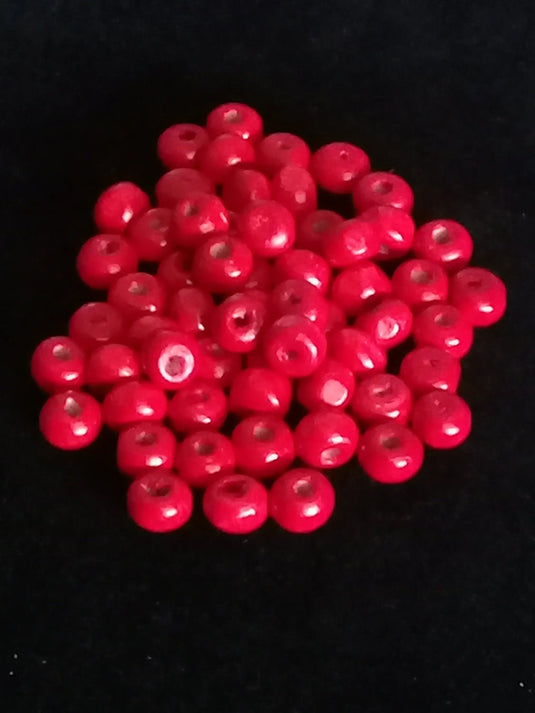 Perle bois rouge Corail Diam : 6 à 8mm X 5mm Prix perle à l’unité Perle en bois peinte en rouge Diamètre 6 à 8mm X 5mm Dans la besace du p'tit Poucet   